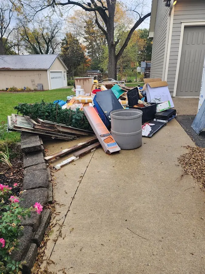 Dumpster being loaded with debris for Estate Cleanout Dumpster Rental in Neshannock